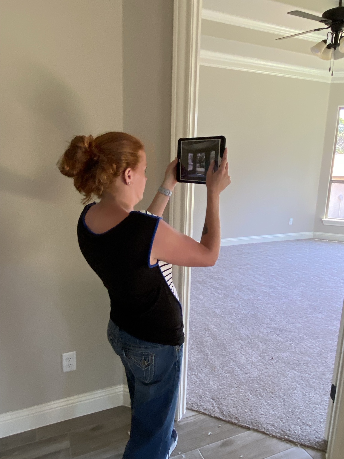 Tracy documenting property details on site