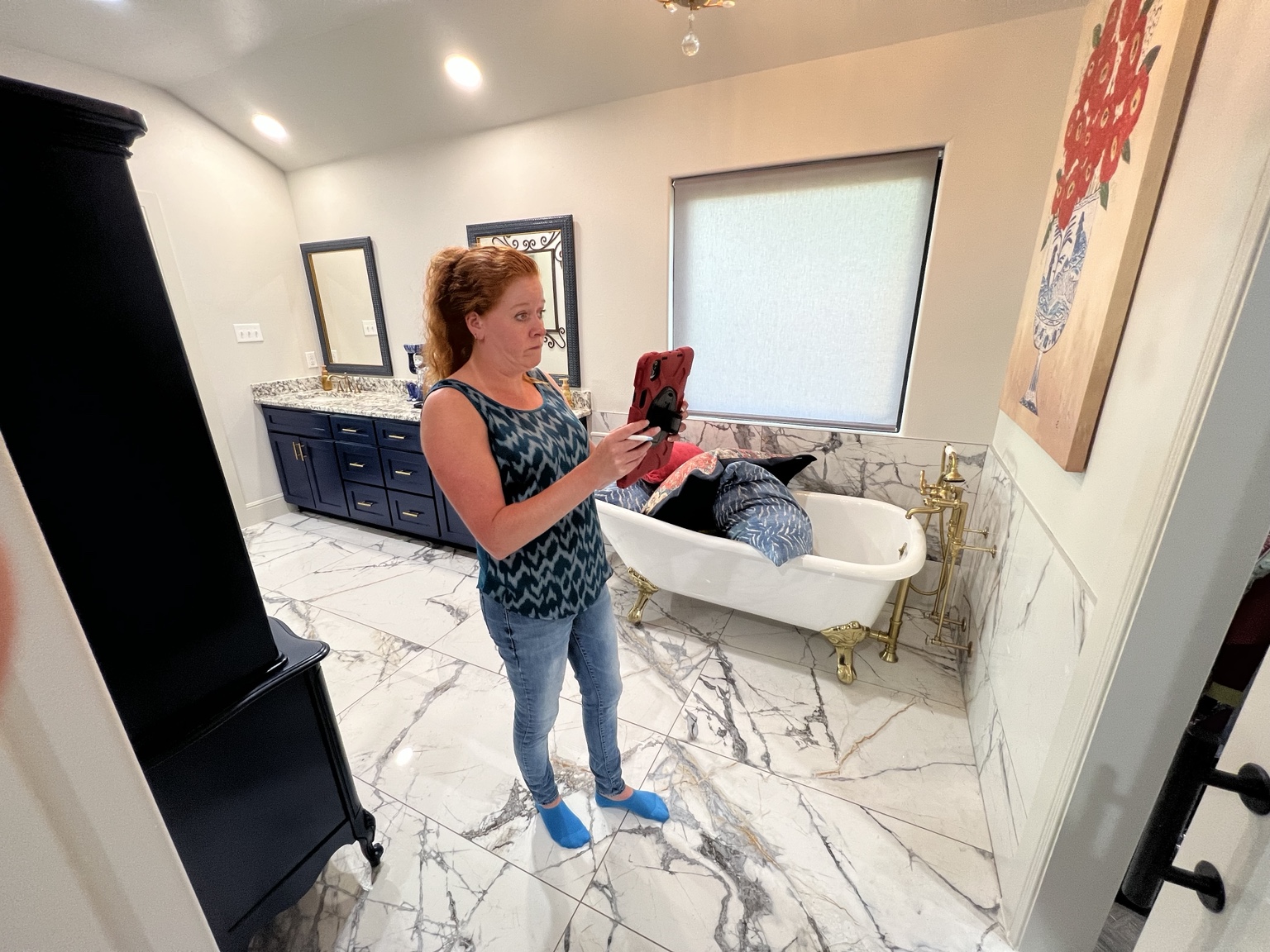 Tracy documenting a home's interior during a property inspection